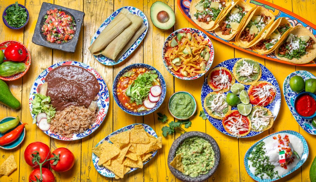 A table full of different types of Hispanic dishes in El Paso.