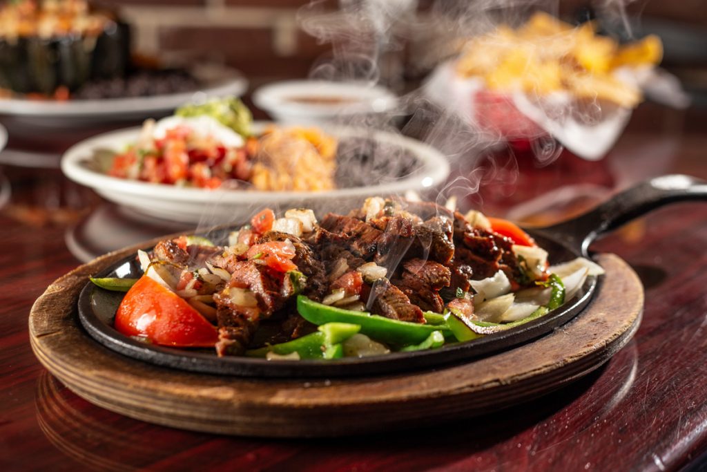 A steaming Mexican meat dish in El Paso.